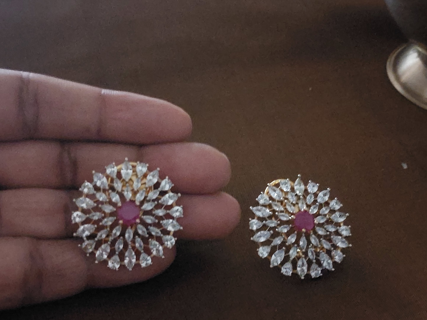Floral design studs in red and white stones