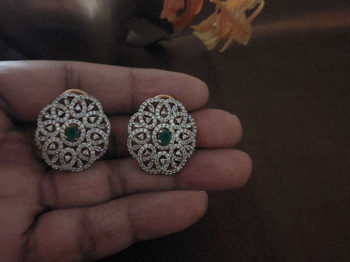 Floral design studs in green and white stones