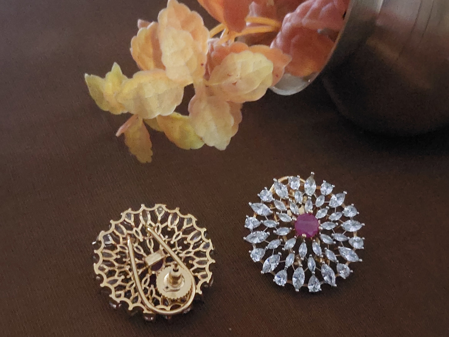 Floral design studs in red and white stones