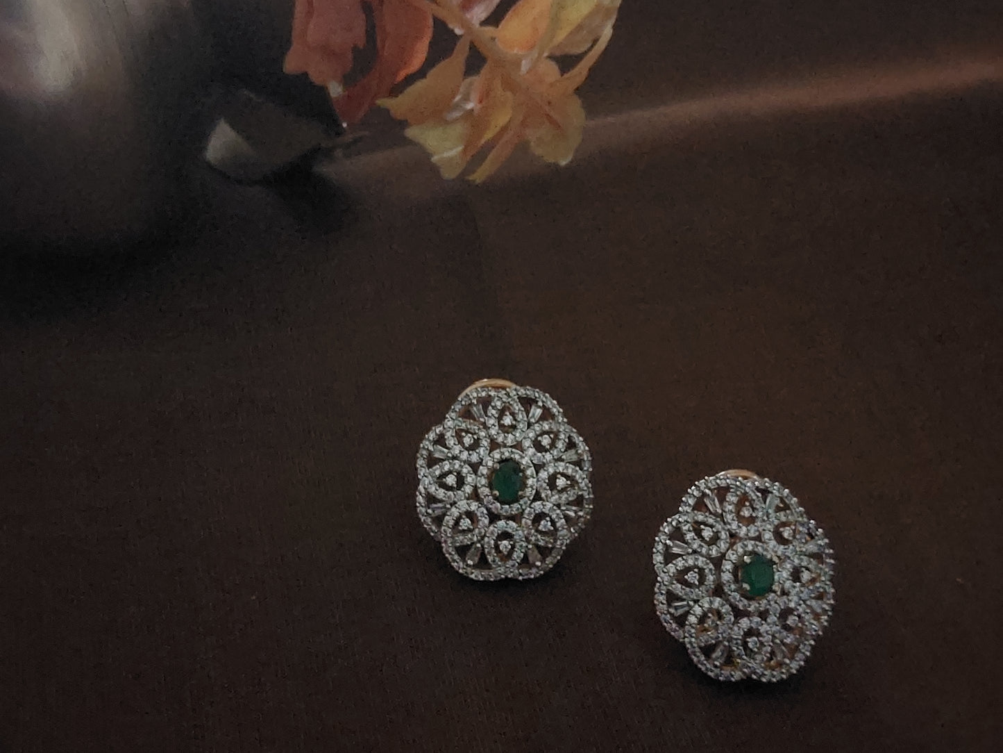 Floral design studs in green and white stones