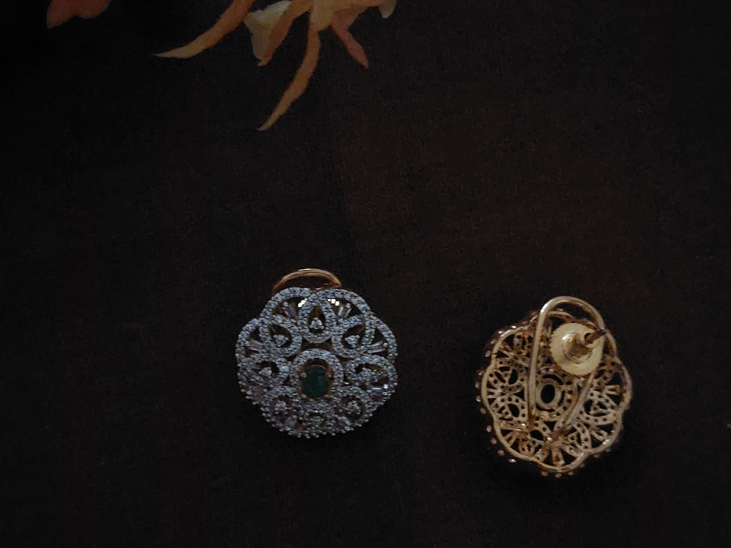 Floral design studs in green and white stones