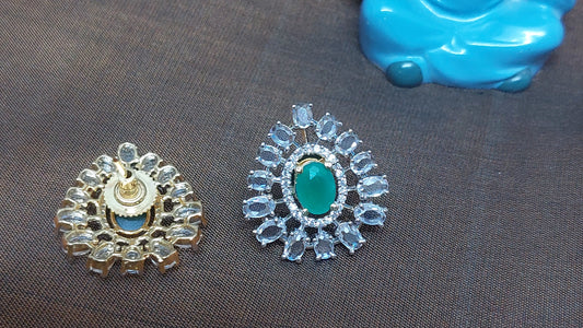 Drop shaped studs in Green and white glass stones