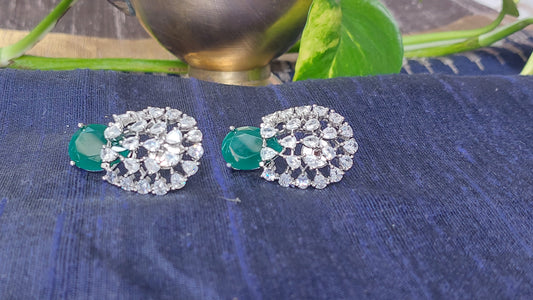 Floral design studs in green and white stones