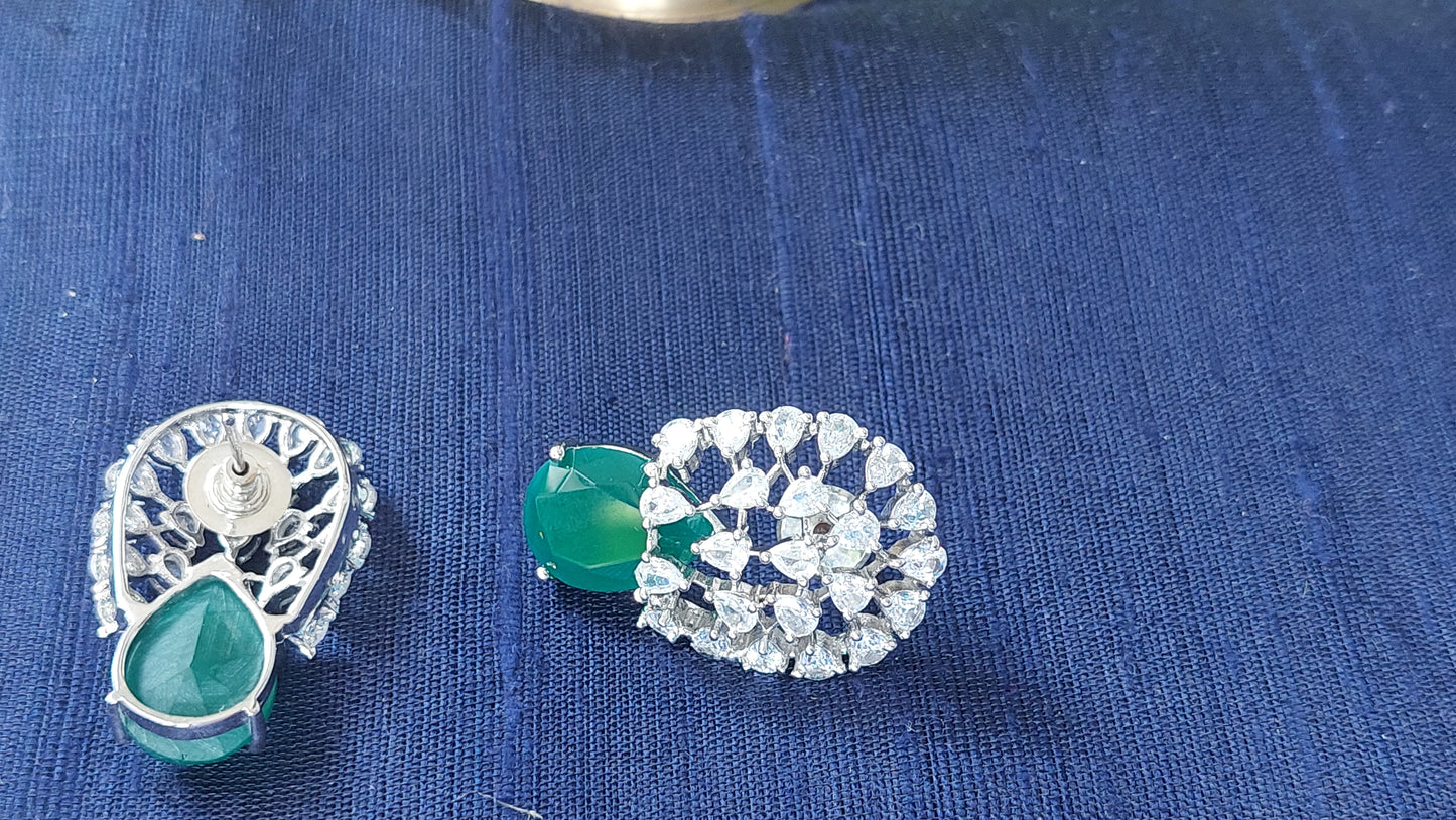 Floral design studs in green and white stones